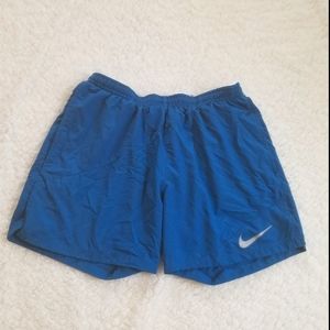 Blue nike running/athletic shorts with pockets